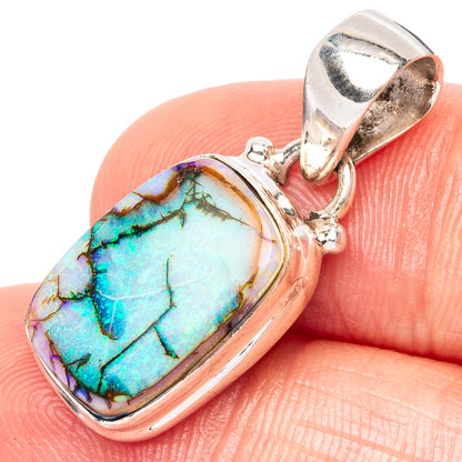 Sterling silver opal pendant with oval cabochon, rainbow blue-green gemstone.