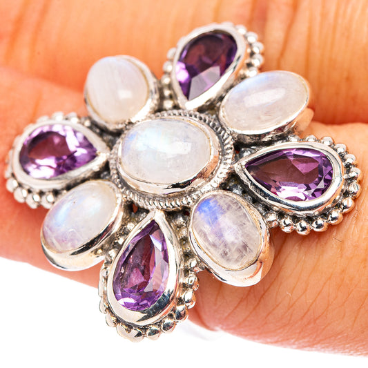Sterling silver flower ring with purple amethyst side stones and iridescent moonstone-like cabochons