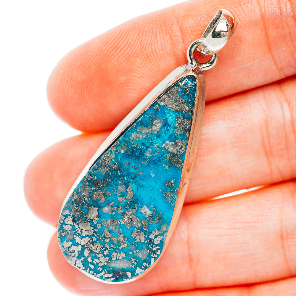 Teardrop turquoise pendant with silver-tone bezel and textured blue stone