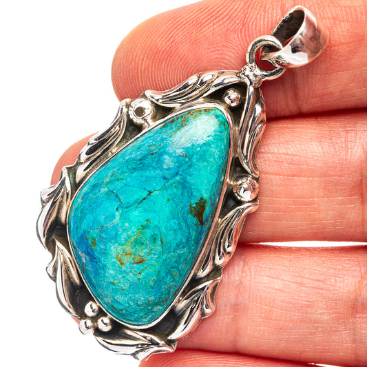 Turquoise opal teardrop pendant in .925 sterling silver with ornate bezel setting