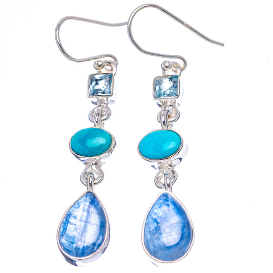 Sterling silver drop earrings with turquoise and blue teardrop stones on hooks