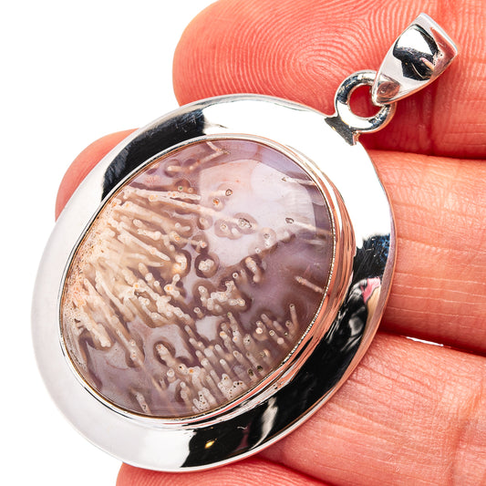 Sterling silver tube agate pendant with oval purple-brown stone and curved bail