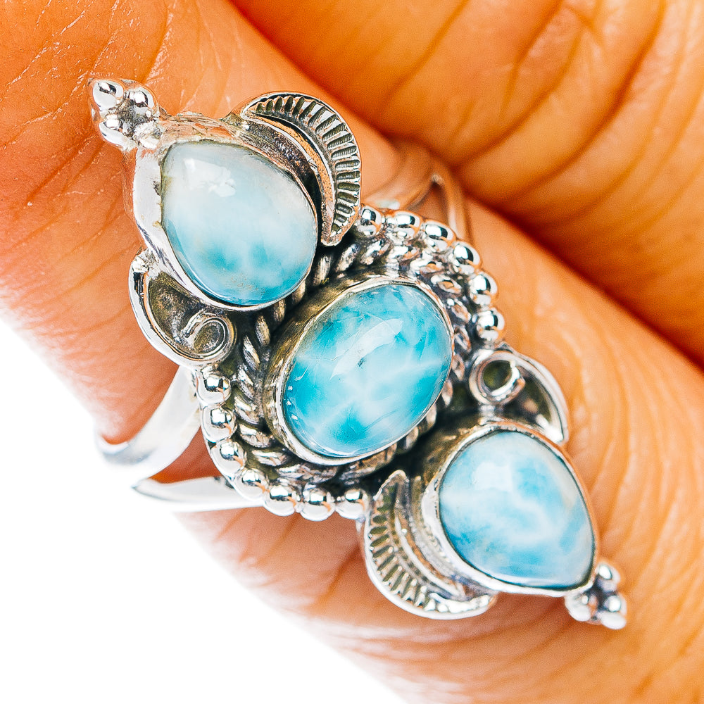 Sterling silver ring with three oval light-blue larimar stones in ornate setting
