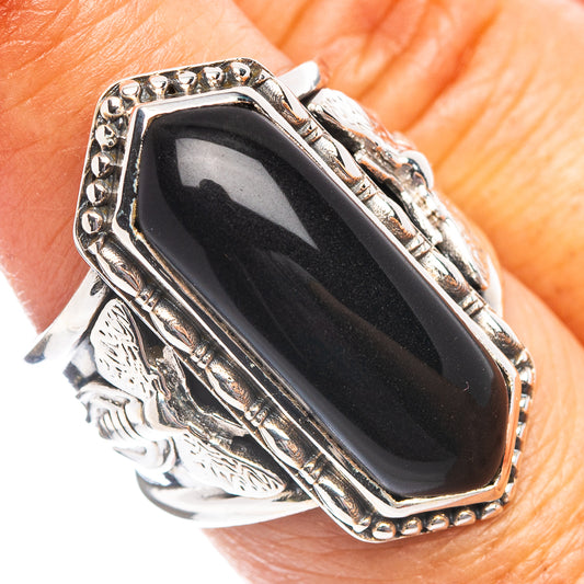 Oval black onyx sterling silver ring with beaded bezel and engraved metal sides