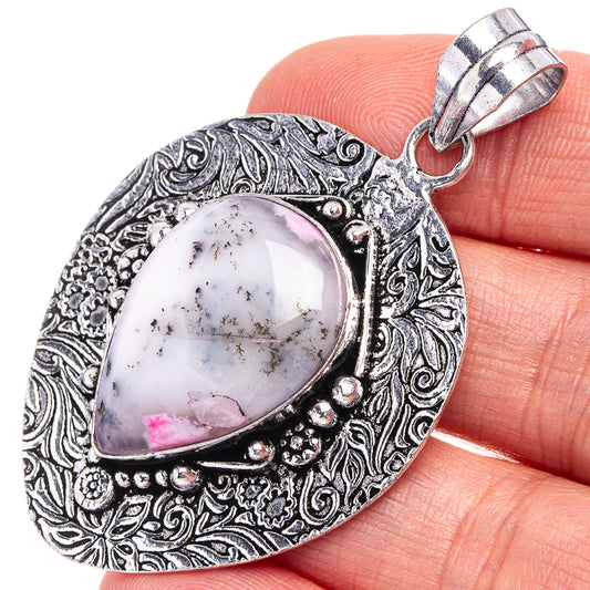 German silver teardrop opal pendant close-up with pink dendritic inlay and bail