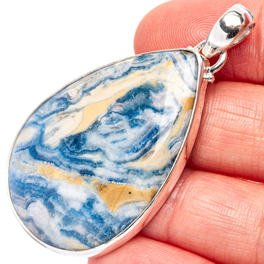 Sterling silver bail teardrop pendant with blue-and-white scheelite stone detail