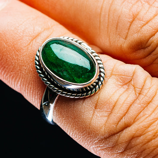 Oval green emerald cabochon in .925 sterling silver ring with rope bezel and band