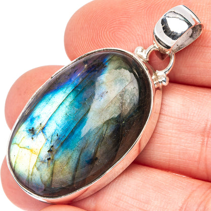 Oval labradorite pendant in polished 925 silver bezel, with round bail loop