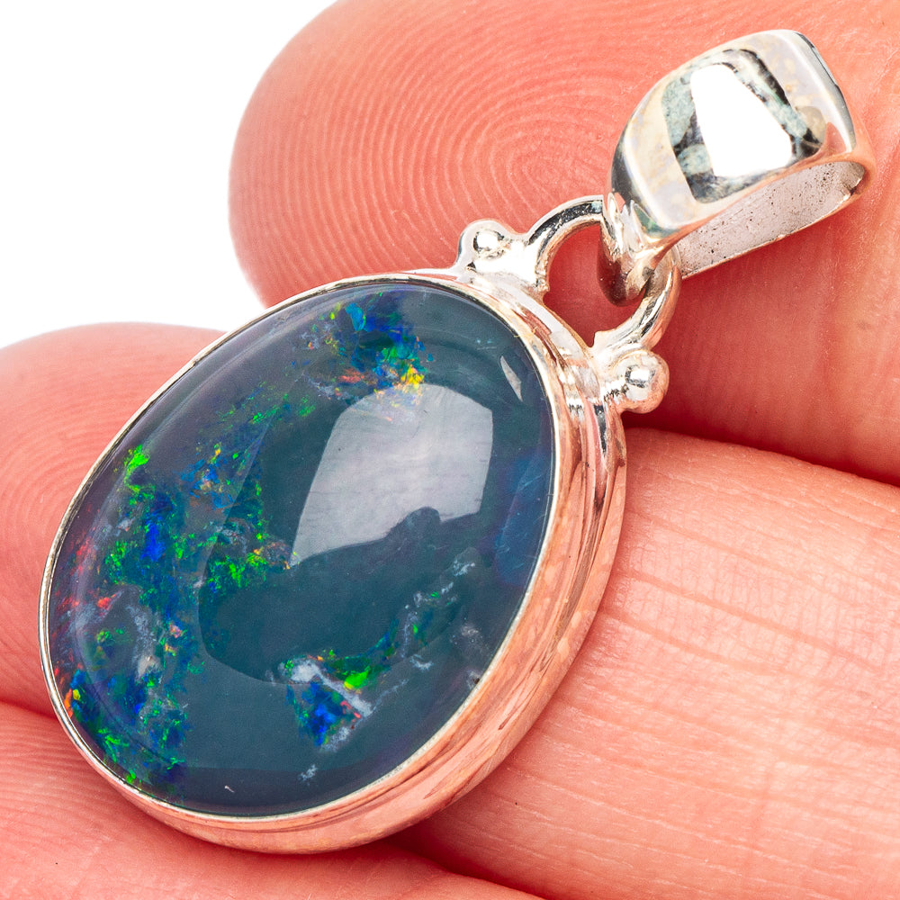 Oval 925 sterling silver opal pendant with blue-green triplet and rainbow specks.