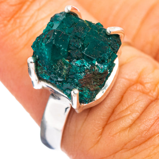 Sterling silver dioptase ring with rough green gemstone and open prong setting