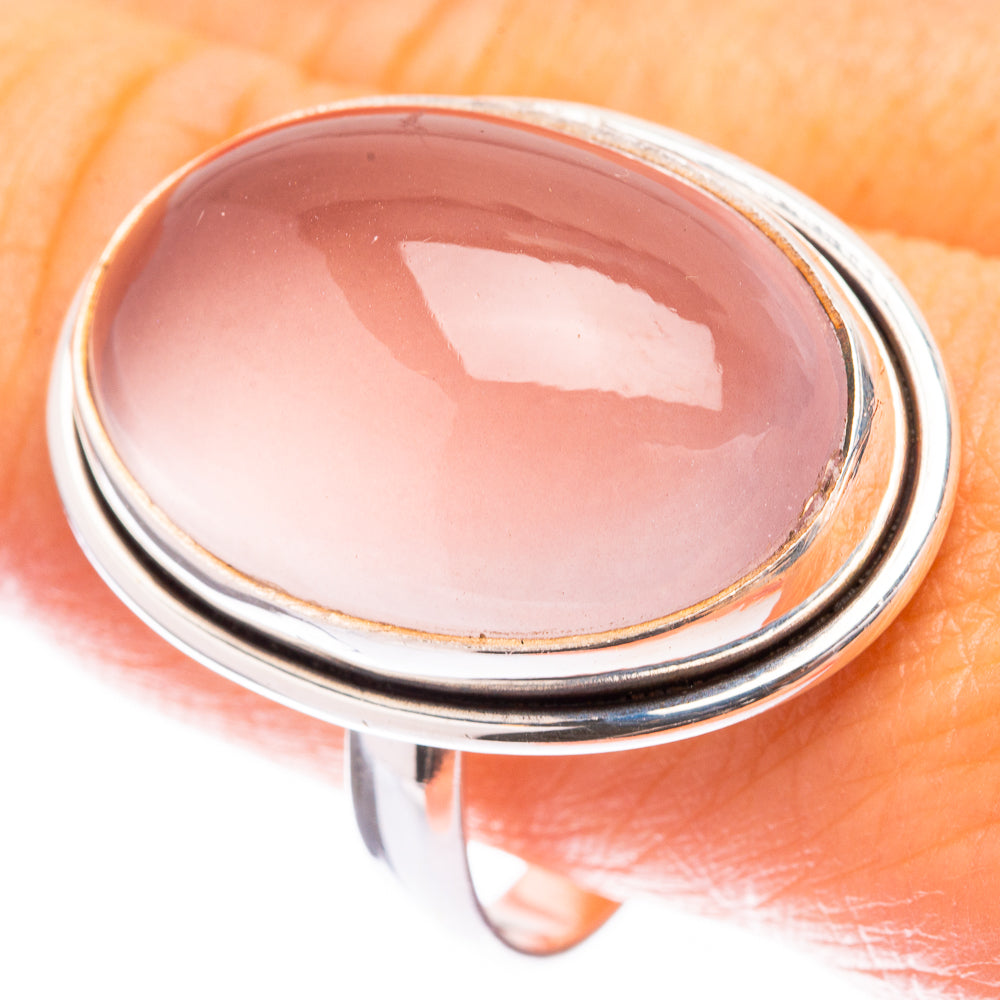 Large oval rose quartz cabochon ring in sterling silver bezel setting