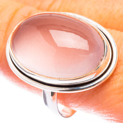 Large oval rose quartz cabochon ring in sterling silver bezel setting