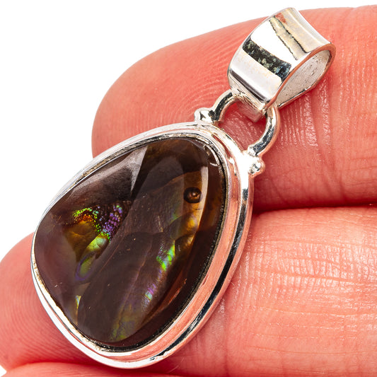 Sterling silver fire agate pendant, close-up oval dark stone with colorful rainbow fire