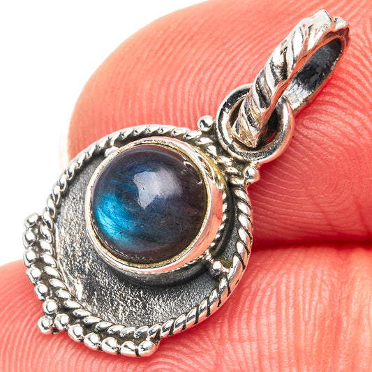 Labradorite pendant with oval blue cabochon in ornate sterling silver setting, bail and frame