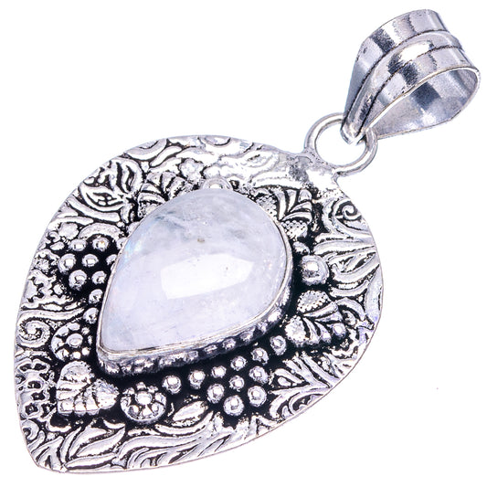 German silver teardrop pendant with moonstone cabochon and engraved floral frame