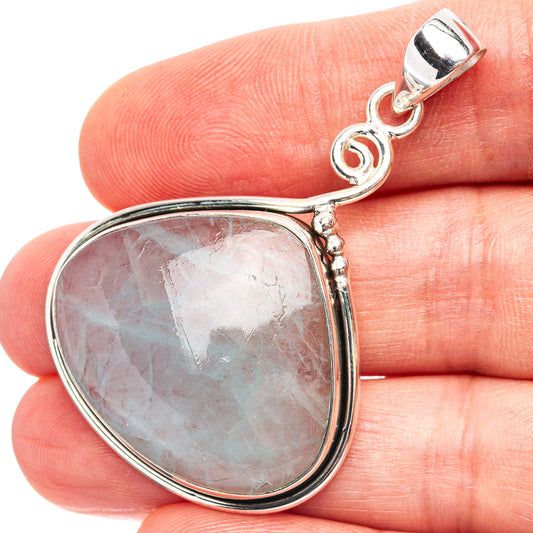 Teardrop gemstone pendant with light aquamarine-toned stone, .925 sterling silver setting