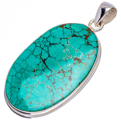 Oval turquoise pendant in sterling silver bezel with top bail, blue-green vein pattern