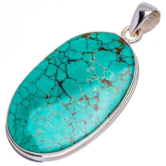 Oval turquoise pendant in sterling silver bezel with top bail, blue-green vein pattern