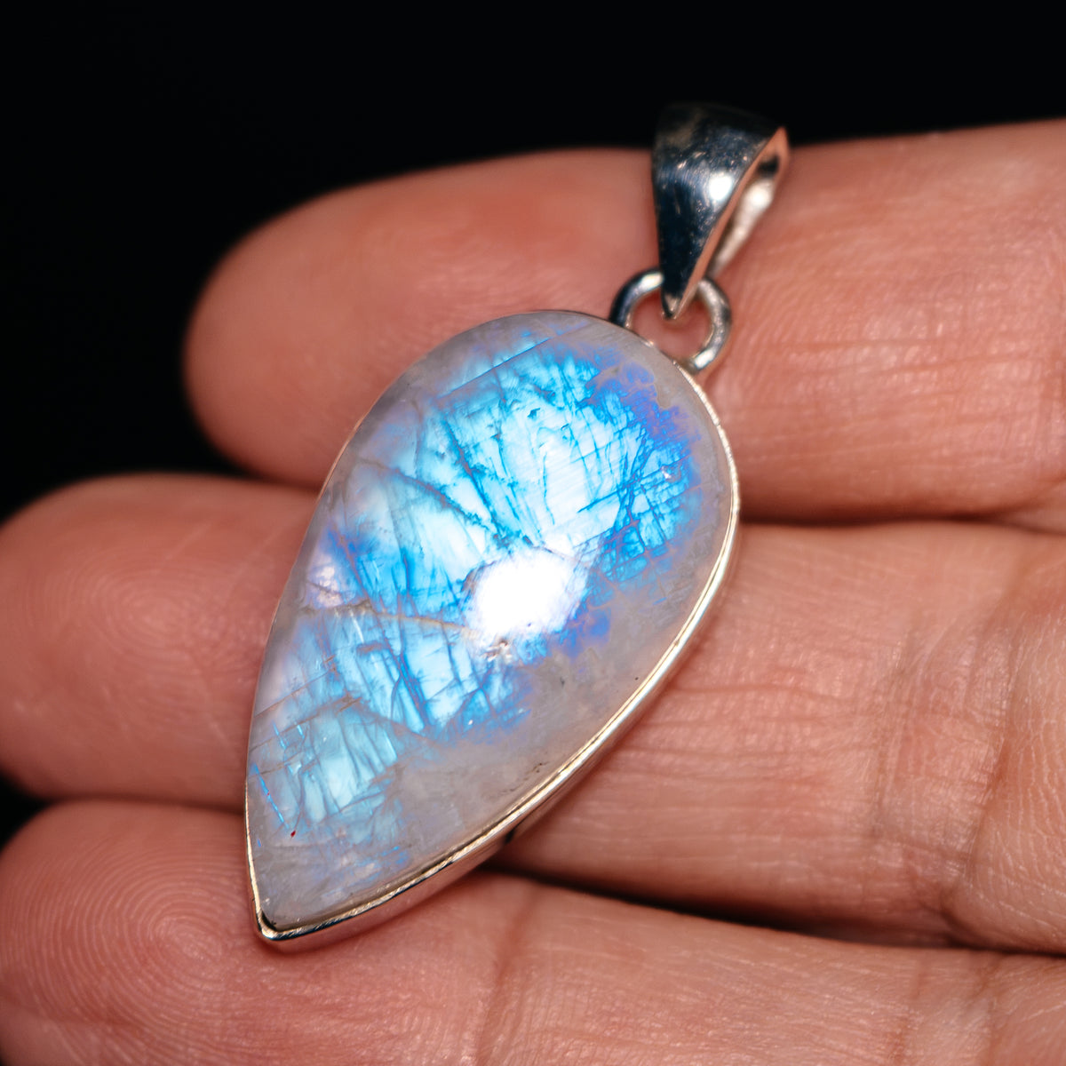 Rainbow moonstone pendant in teardrop shape with .925 sterling silver bezel and bail