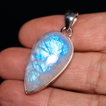 Rainbow moonstone pendant in teardrop shape with .925 sterling silver bezel and bail