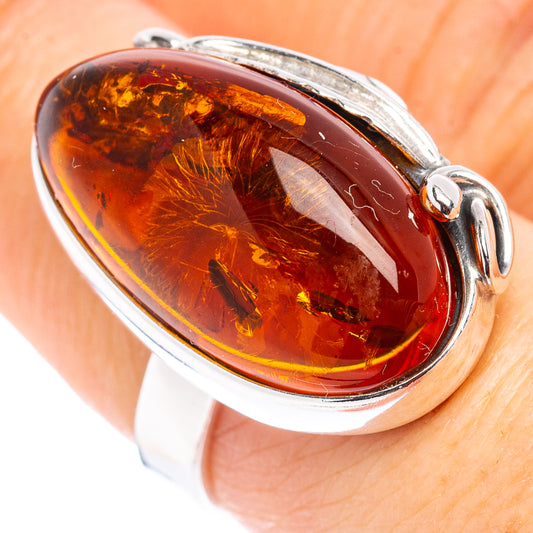 Sterling silver amber ring with oval honey amber stone and adjustable band