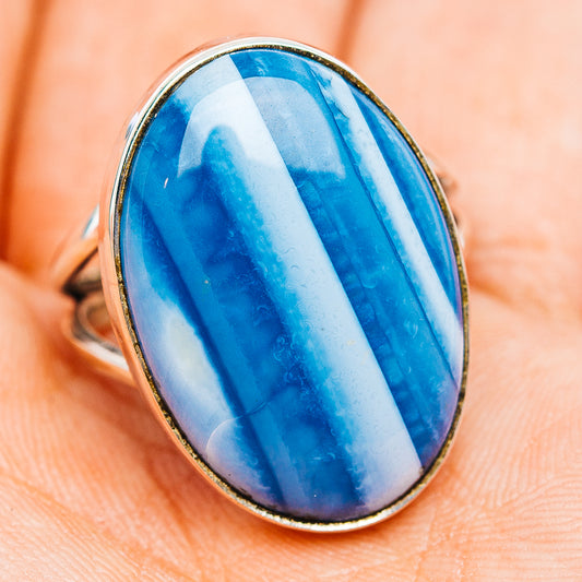Oval blue opal cabochon ring in .925 sterling silver bezel, wide band