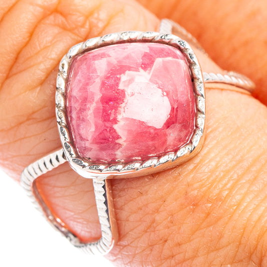 Sterling silver rhodochrosite ring with pink oval cabochon and rope-textured band