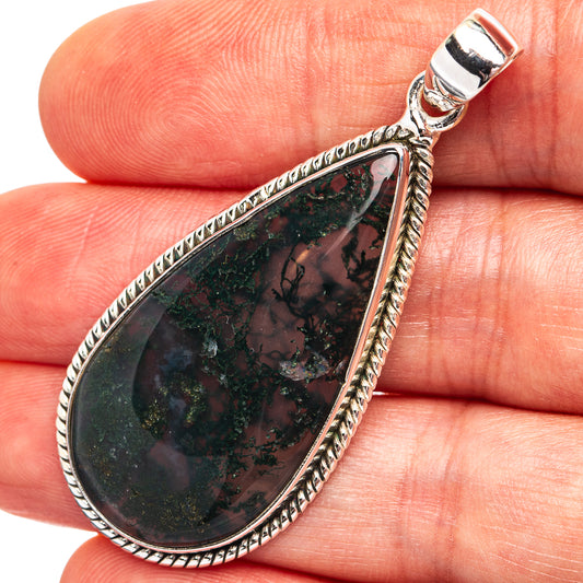 Teardrop moss agate pendant in .925 sterling silver, dark green stone framed in silver
