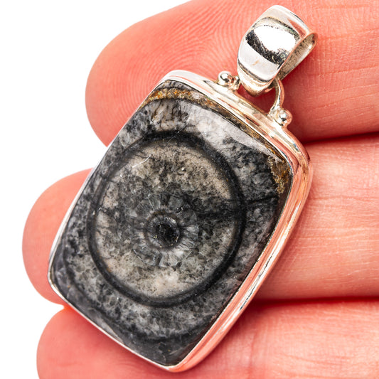 Sterling silver pendant with black horn coral fossil pattern, rectangular frame, bail top