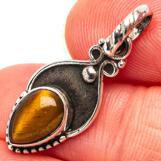 Oval tiger’s eye cabochon dainty pendant in .925 sterling silver, close-up detail