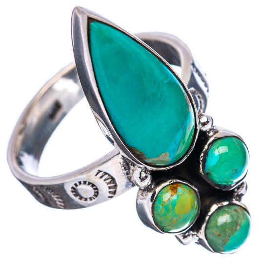 Turquoise cabochon sterling silver ring with patterned band and oval center stone.