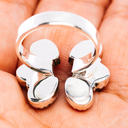 Southwestern style adjustable silver ring with four reflective petal-like stone settings