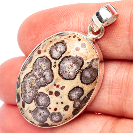 Oval .925 sterling silver jasper pendant with mottled asteroid pattern and bail