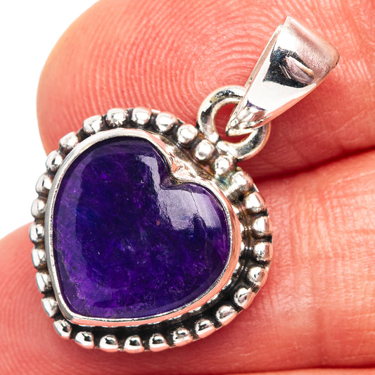 Heart pendant with oval purple sugilite in .925 sterling silver bezel