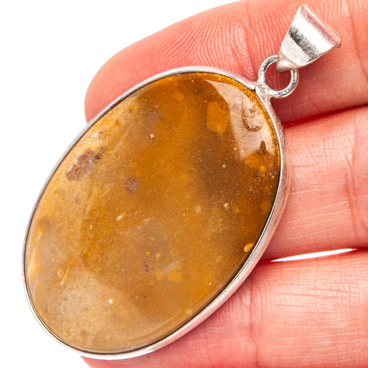 Silver-plated agate pendant with oval amber stone and loop bail