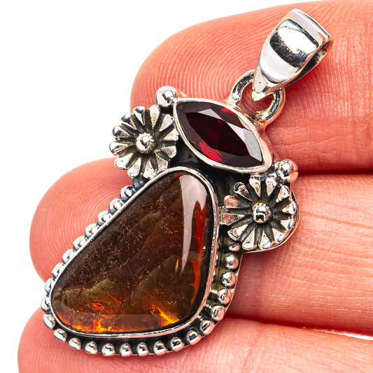 Garnet red ammolite teardrop pendant in .925 sterling silver with floral accents