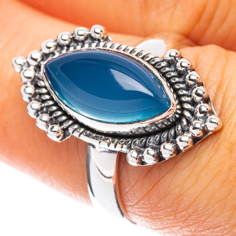 Sterling silver ring with oval blue chalcedony stone, beaded halo setting