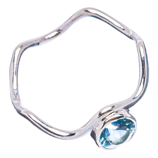 Sterling silver open band ring with blue topaz oval bezel