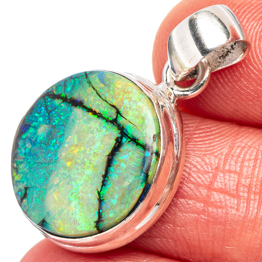 Sterling silver opal pendant close-up, oval turquoise opal with black veining
