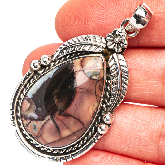 Sterling silver oval jasper pendant with butterfly detail and polished bezel