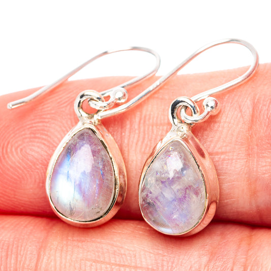 Iridescent rainbow moonstone teardrop earrings on silver hooks, close-up