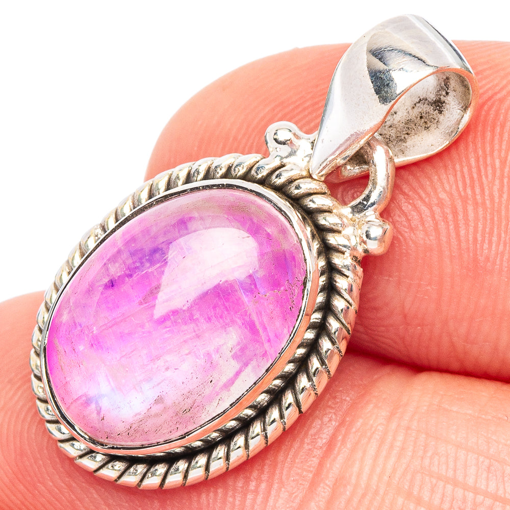 Oval pink moonstone pendant with ornate sterling silver setting