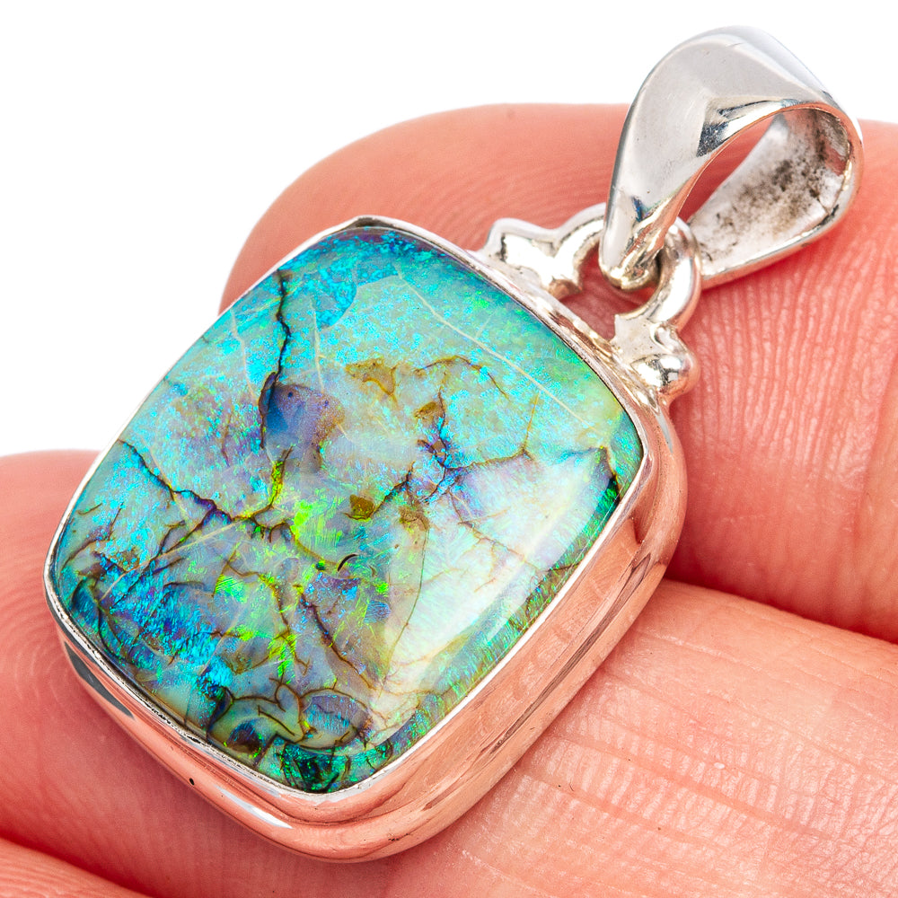 Sterling silver opal pendant with square bezel and colorful turquoise-blue iridescent stone