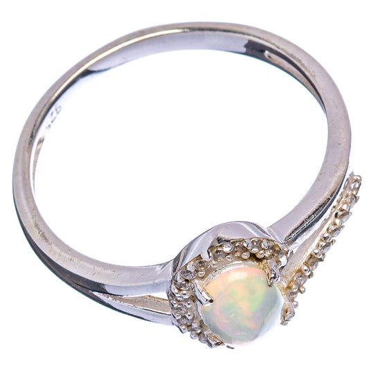 Sterling silver ring showing opal oval center with sparkling cubic zirconia accents