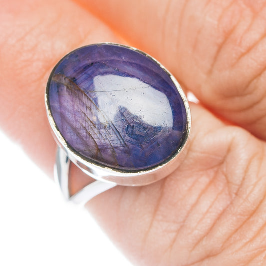Oval purple-blue cabochon ring with sterling silver bezel, close-up on top