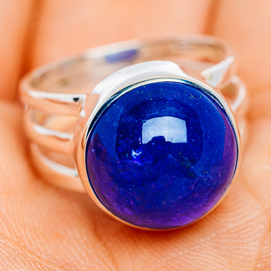 Sterling silver ring with oval blue-purple tanzanite cabochon gemstone and band