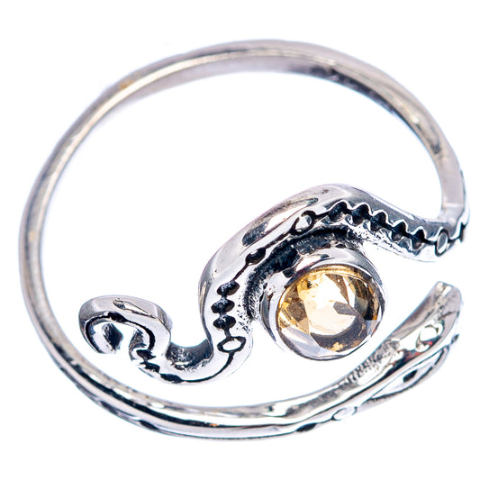 Adjustable sterling silver snake ring with citrine gemstone, open band, and scrollwork design