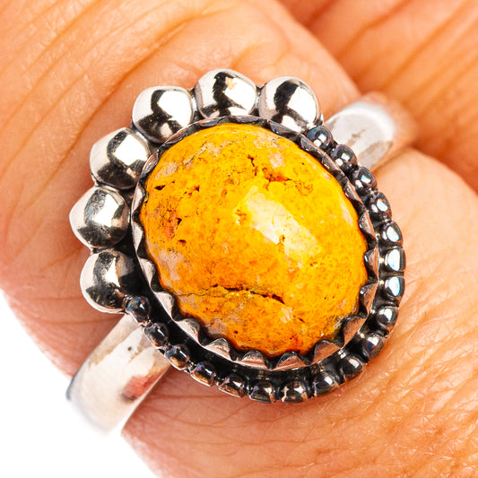 Sterling silver ring with oval honey-orange gemstone and beaded border