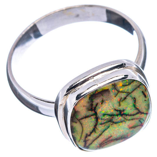 Oval green-and-gold opal cabochon set in polished sterling silver ring band