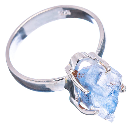 Sterling silver ring with blue raw quartz stone, arched prong setting on band